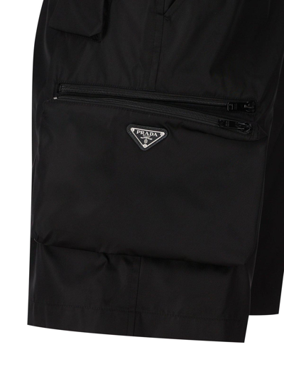 Shop Prada Logo Plaque Zipped Shorts In Nero