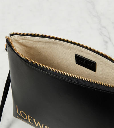 Shop Loewe Logo Embossed Leather Pouch In Black