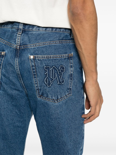 Shop Palm Angels Monogram Denim Jeans In Blue