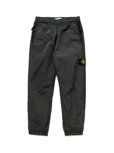 Shop Stone Island Logo Patch Track Pants In Green