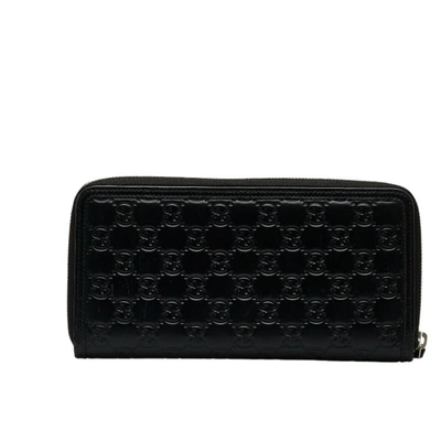 Shop Gucci Signature Treasure Black Leather Wallet  ()