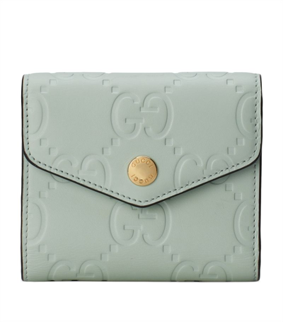 Shop Gucci Debossed Leather Gg Wallet In Green