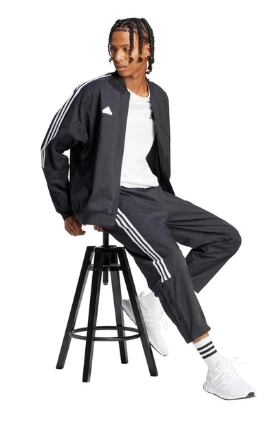 Shop Adidas Originals Tiro Crop Woven Pants In Black