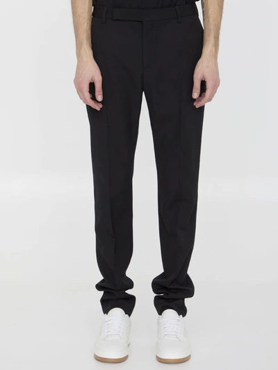 Shop Saint Laurent Wool Trousers In Black