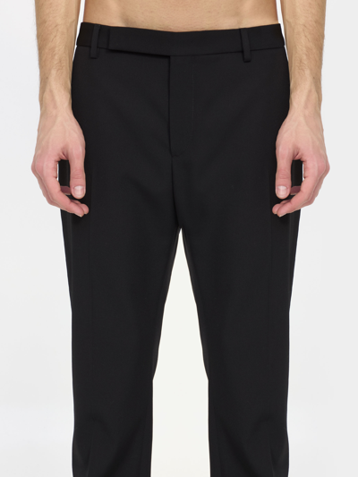 Shop Saint Laurent Wool Trousers In Black