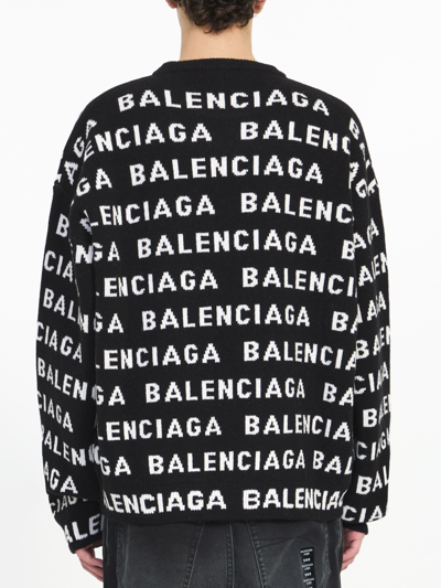 Shop Balenciaga Allover Logo Sweater In Black