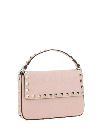 Shop Valentino Garavani Rockstud Handbag In Rose Quartz