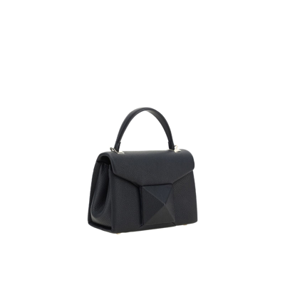 Shop Valentino Garavani One Stud Mini Top Handle Bag In Black