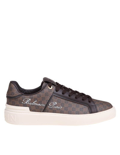 Shop Balmain B-court Sneakers In Monogram Leather In Brown