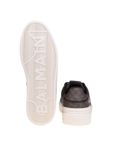 Shop Balmain B-court Sneakers In Monogram Leather In Brown