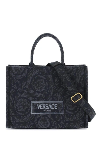 Shop Versace Athena Logo Embroidered Tote Bag In V Black+black  Gold