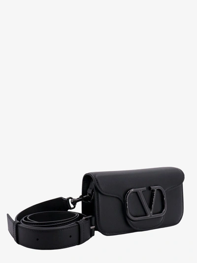 Shop Valentino Garavani Man Mini Locã' Man Black Shoulder Bags