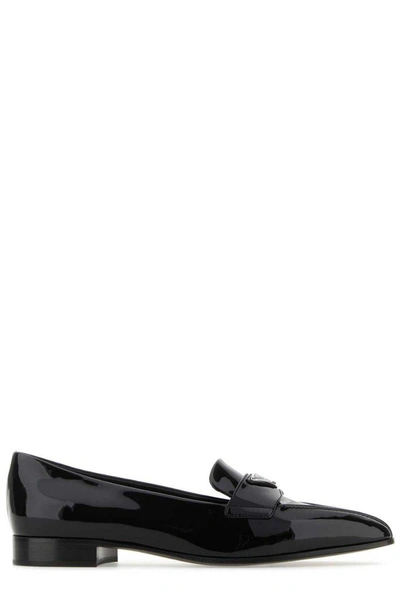 Shop Prada Logo-plaque Pointed Toe Loafers In Black