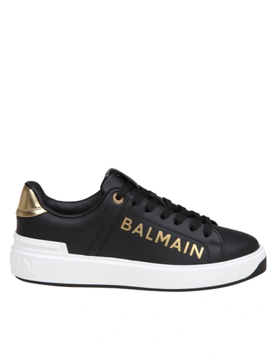 Shop Balmain B-court Sneakers In Black And Gold Leather In Black/gold