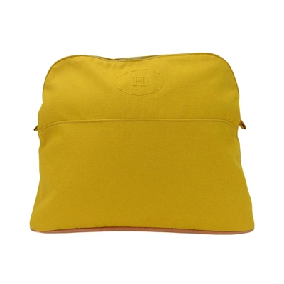 Shop Hermes Hermès Bolide Yellow Canvas Clutch Bag ()