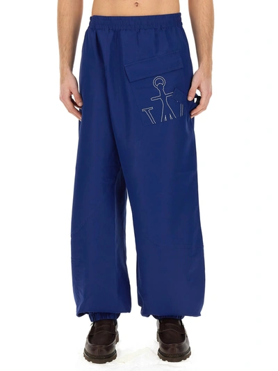 Shop Jw Anderson J.w. Anderson Joggers Pants With Logo Anchor In Blu