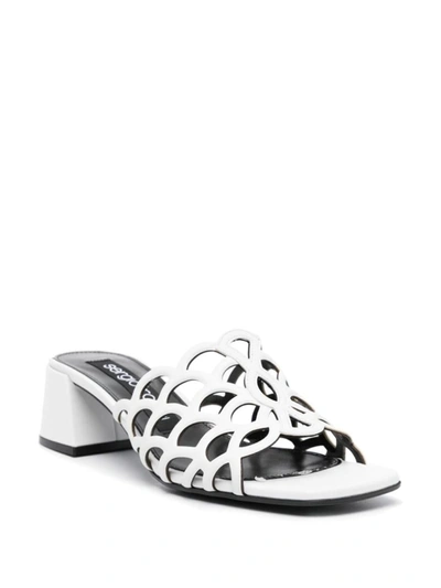 Sergio Rossi Low Block Heel Mules With Openwork Detail In White
