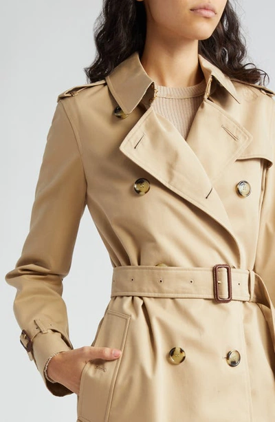 Shop Burberry Kensington Double Breasted Trench Coat In Honey