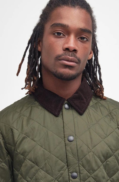 Barbour Heritage Liddesdale Green Jacket With Classic Corduroy Collar And Logo Lettering On The Front In Tec
