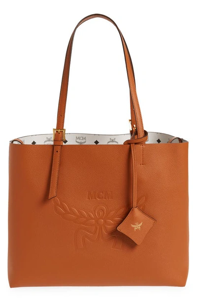 Shop Mcm Medium Lauretos Reversible Leather Shopper Bag In Cognac