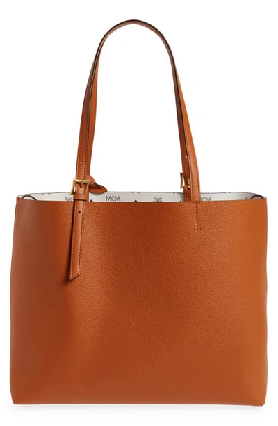 Shop Mcm Medium Lauretos Reversible Leather Shopper Bag In Cognac