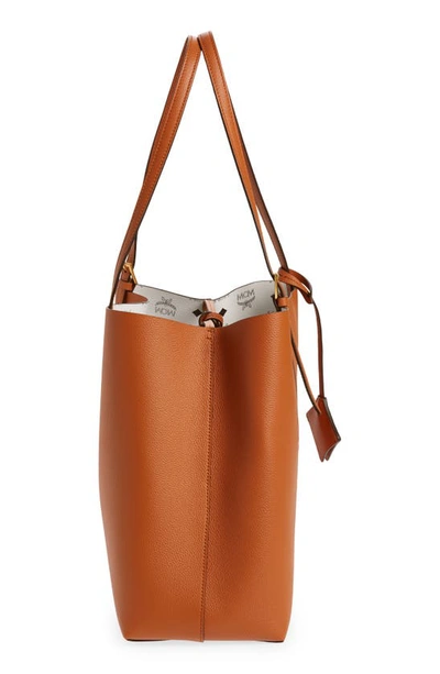 Shop Mcm Medium Lauretos Reversible Leather Shopper Bag In Cognac