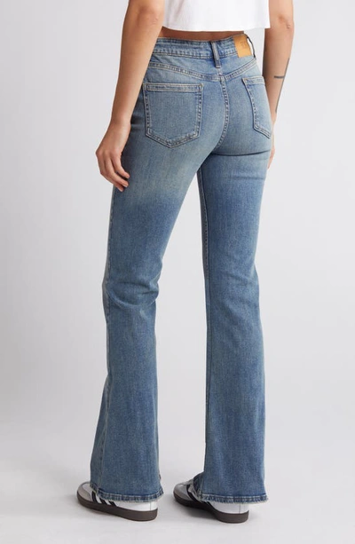 Shop Bdg Urban Outfitters Mid Rise Flare Jeans In Light Wash