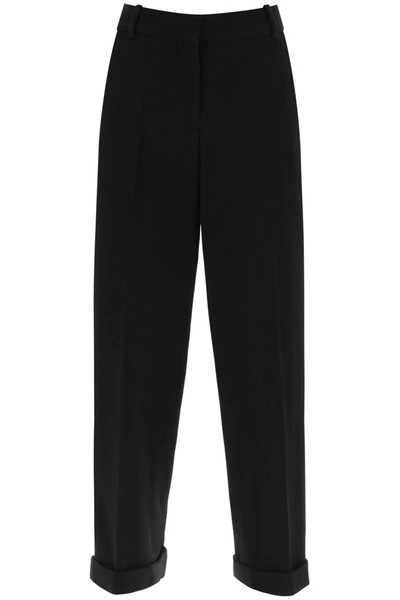 Shop Balmain Cuffed Wool Crepe Trousers In Noir (black)