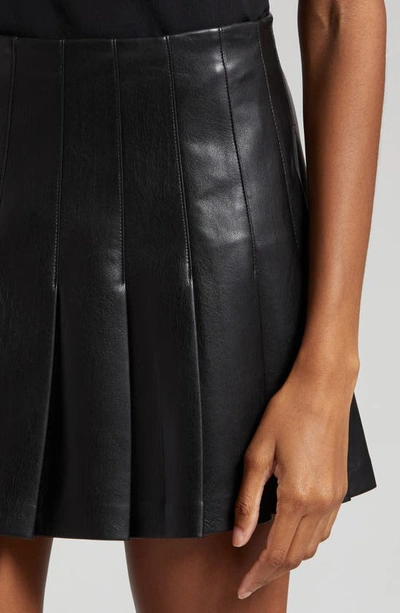 Shop Alice And Olivia Carter Pleated Faux Leather Miniskirt In Black