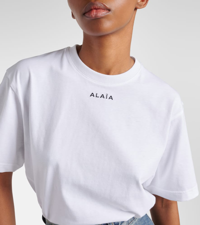 Shop Alaïa Fluid Cotton Jersey Bodysuit In White