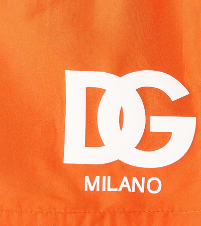 Shop Dolce & Gabbana Baby Dg Swim Trunks In Orange