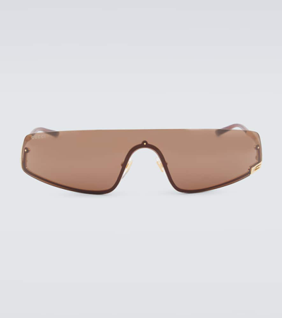 Shop Gucci Tom Shield Sunglasses In Gold