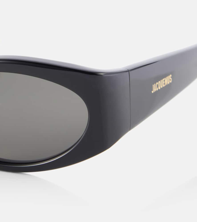 Shop Jacquemus Les Lunettes Ovalo Oval Sunglasses In Black