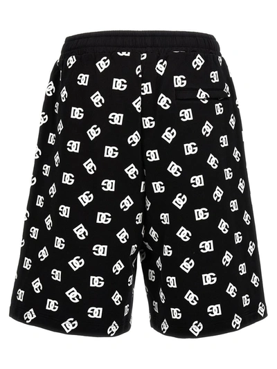 Shop Dolce & Gabbana All Over Logo Bermuda Shorts In White/black