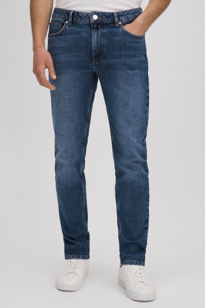 Shop Reiss Calik - Mid Blue Wash Tapered Slim Fit Washed Jeans, 36