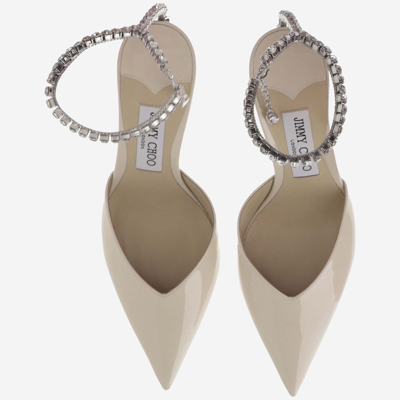 Shop Jimmy Choo Saeda 85mm Patent Leather Pumps In Linen/crystal