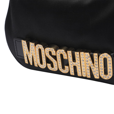 Shop Moschino Lettering Shoulder Bag In Black