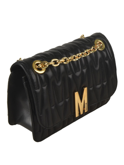Shop Moschino Logo Quilted Chain Shoulder Bag In 1555