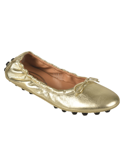 Shop Tod's Gommini Ballerinas In Gold