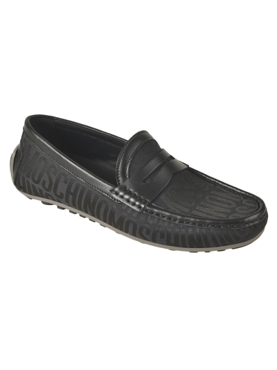 Shop Moschino All-over Logo Loafers In Black