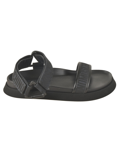 Shop Moschino Logo Strap Flat Sandals In Black