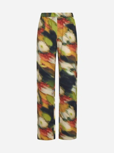 Shop Stine Goya Marc Floral Print Trousers In Flowers In Fast Motion