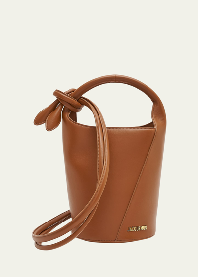 Shop Jacquemus Le Petit Tourni Leather Bucket Bag In Light Brown