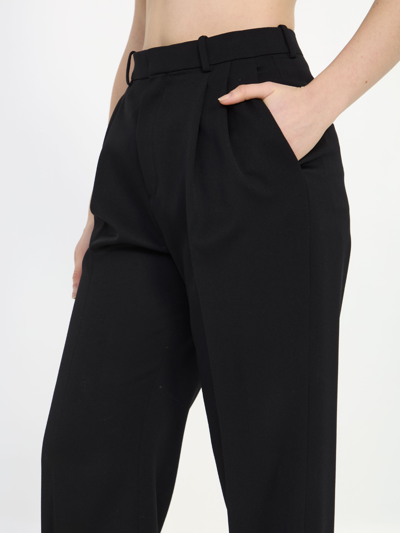 Shop Saint Laurent Grain De Poudre Trousers In Black