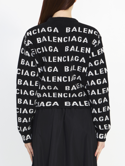 Shop Balenciaga Allover Logo Sweater In Black