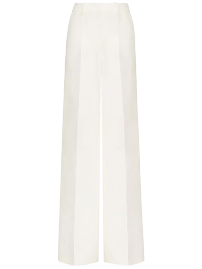 Shop Valentino Toile Iconographe Trousers In Cream