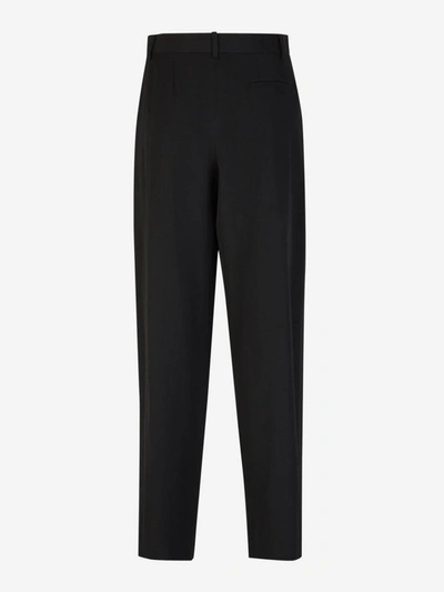 Shop The Row Pleated Wool Pants In Negre