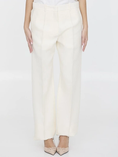 Shop Valentino Toile Iconographe Trousers In Cream