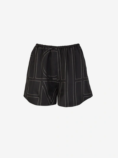 Shop Totême Monogram Silk Shorts In Negre