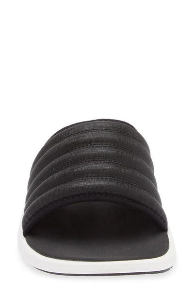 Shop Olukai Komo Slide Sandal In Black / Black